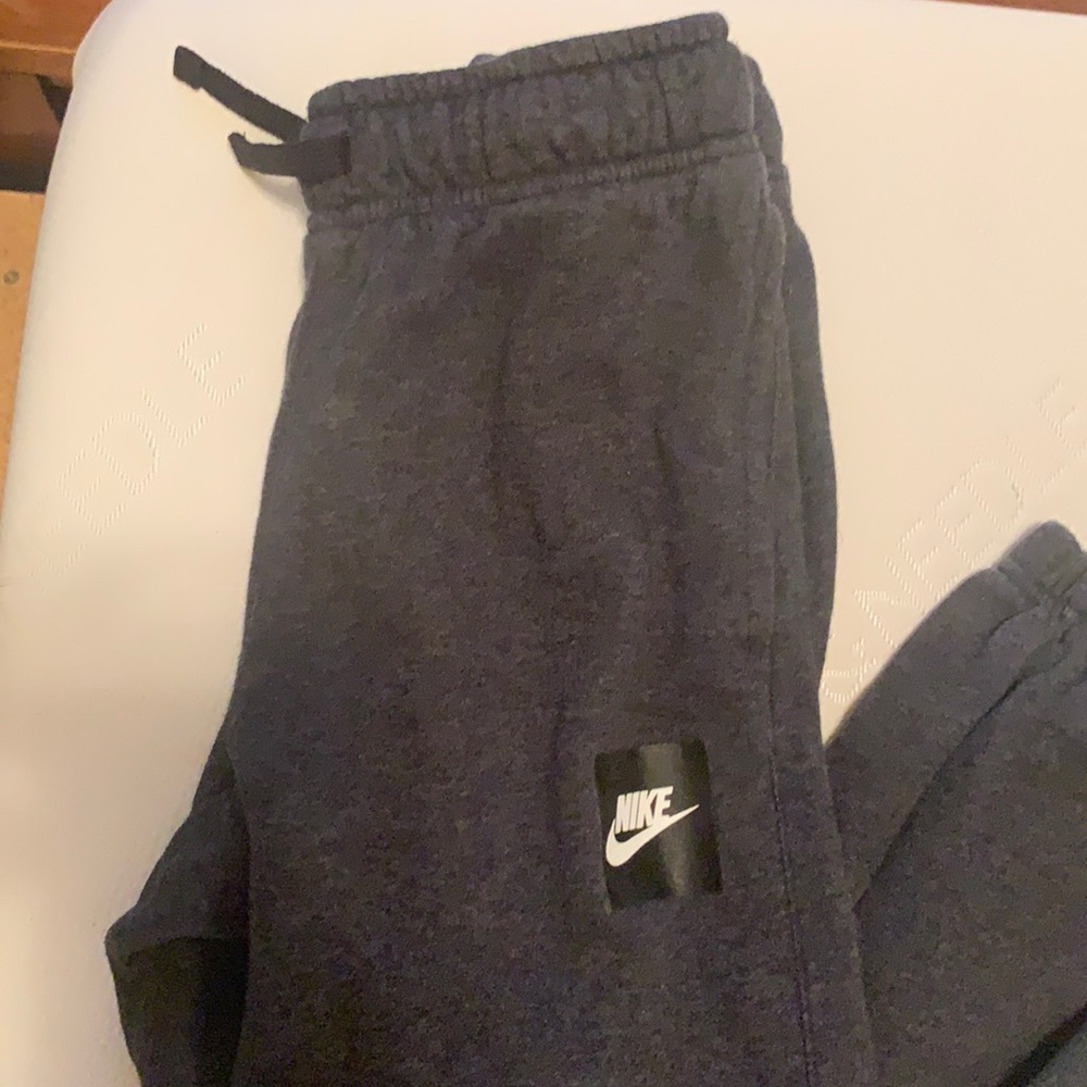 Pair of boys size medium and large Nike joggers Liz very good condition.